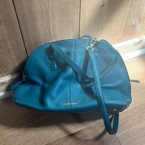 Vera Bradley dark green with floral pattern inside, pebbled leather